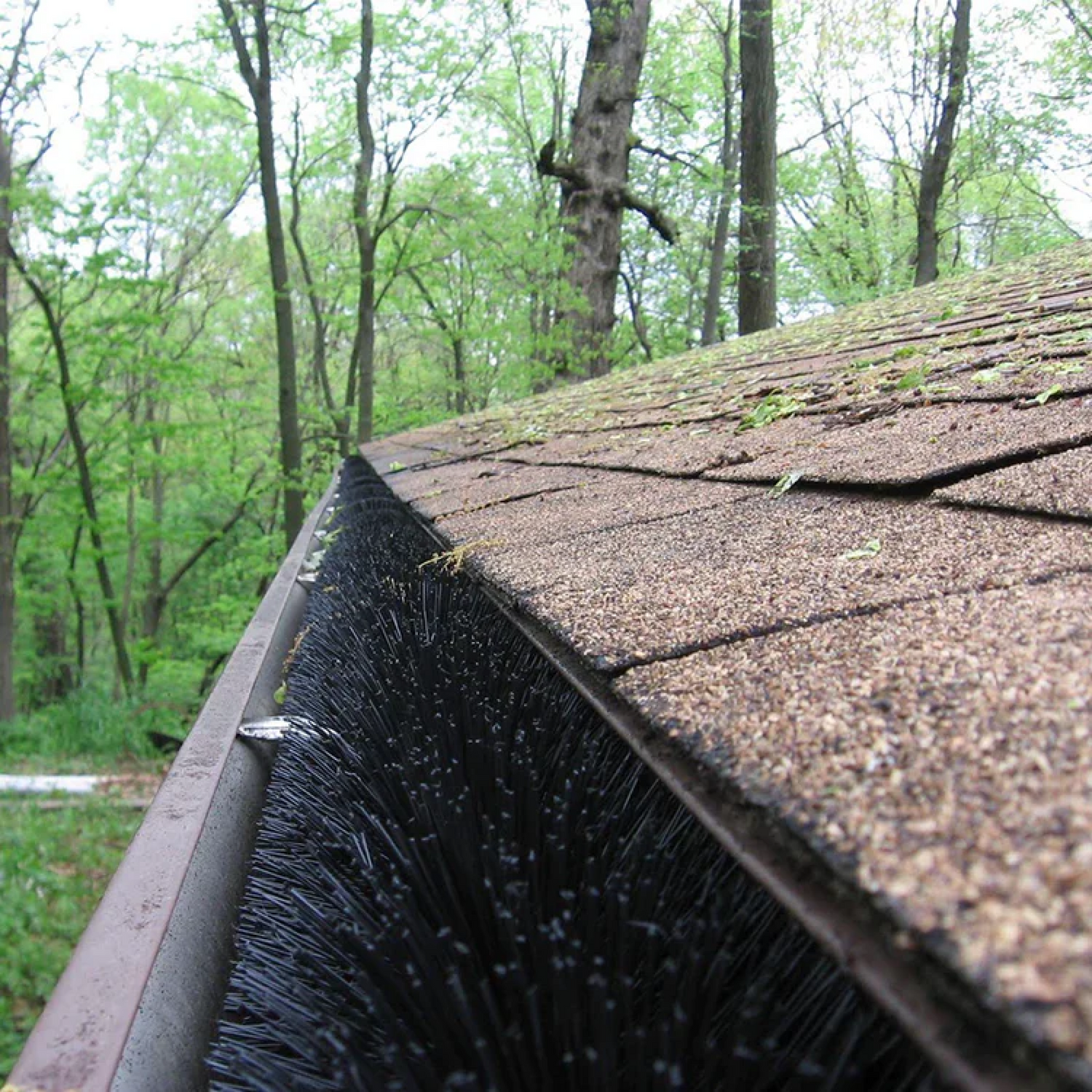 GutterBrush fills the entire gutter blocking leaves while water flows