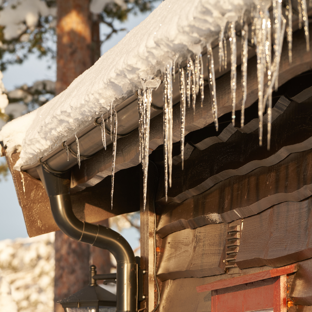 Cleaning gutters to prevent ice dams in winter