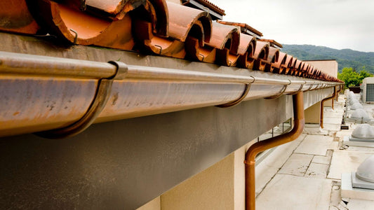 copper half round gutter and tile roof
