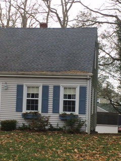 Gutter Helmet Cover Intersects the roof, covered with gutter leaves