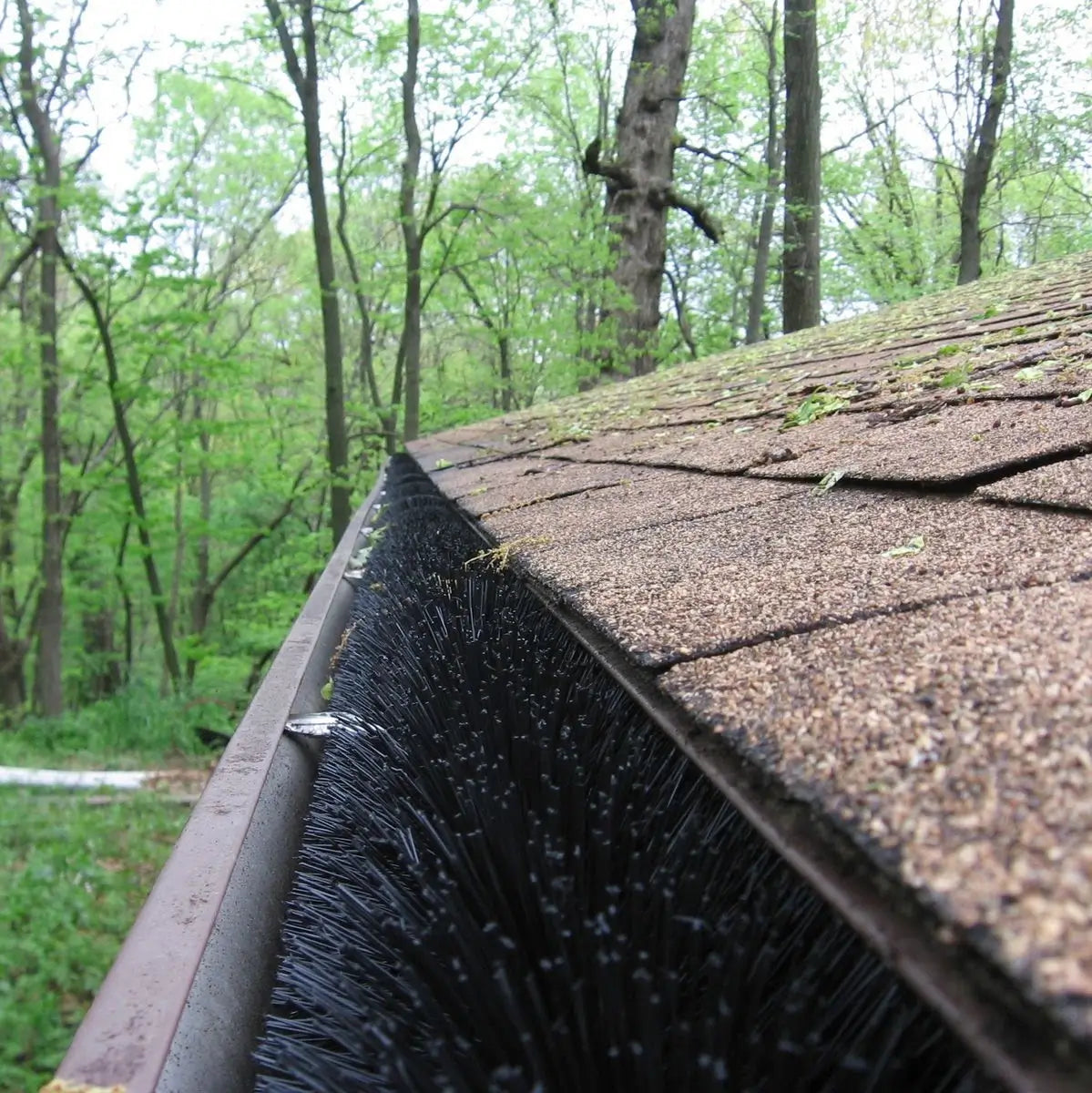 GutterBrush fills the entire gutter blocking leaves while water flows