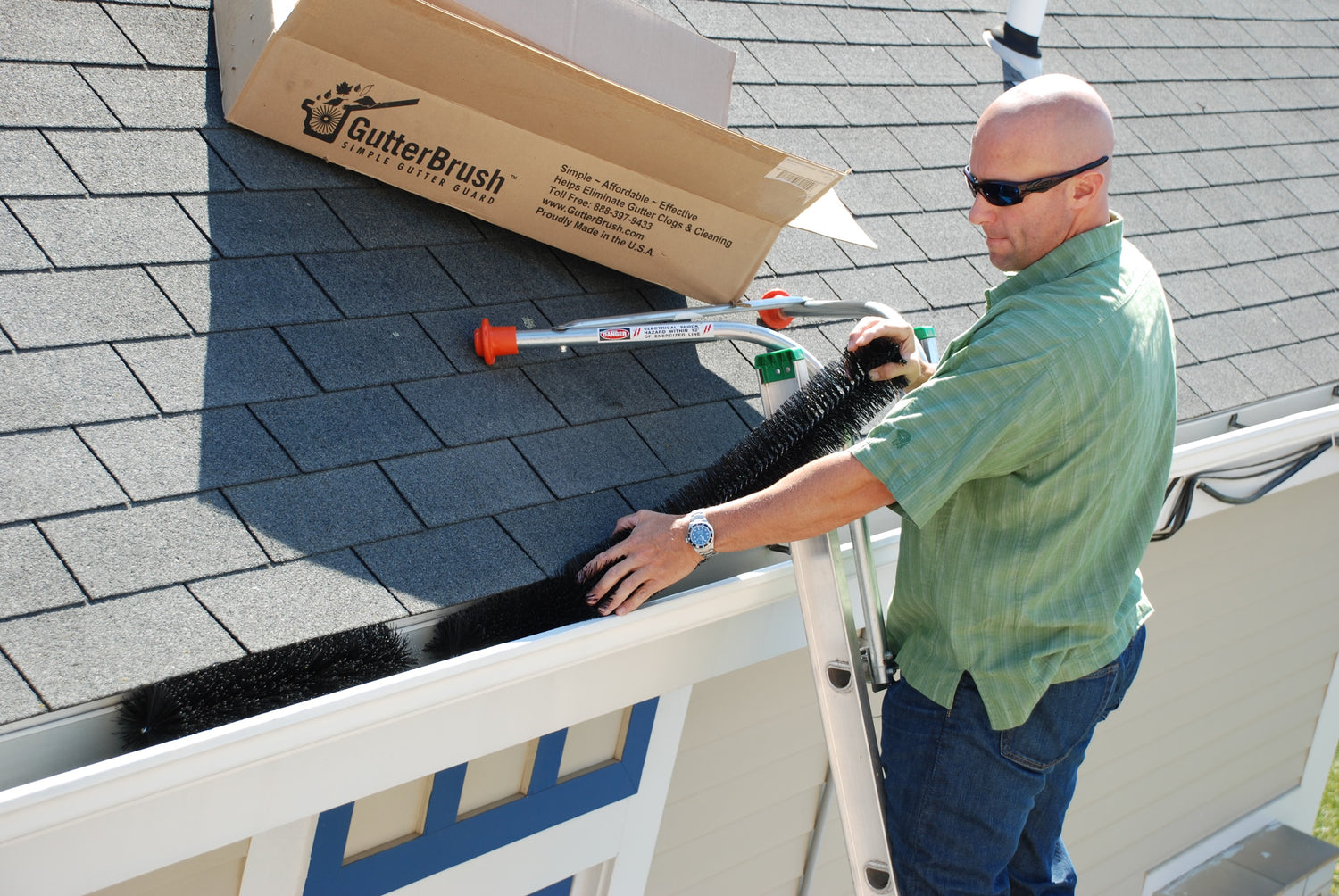 Man installing Gutter Brush Leaf Guards With No Tools